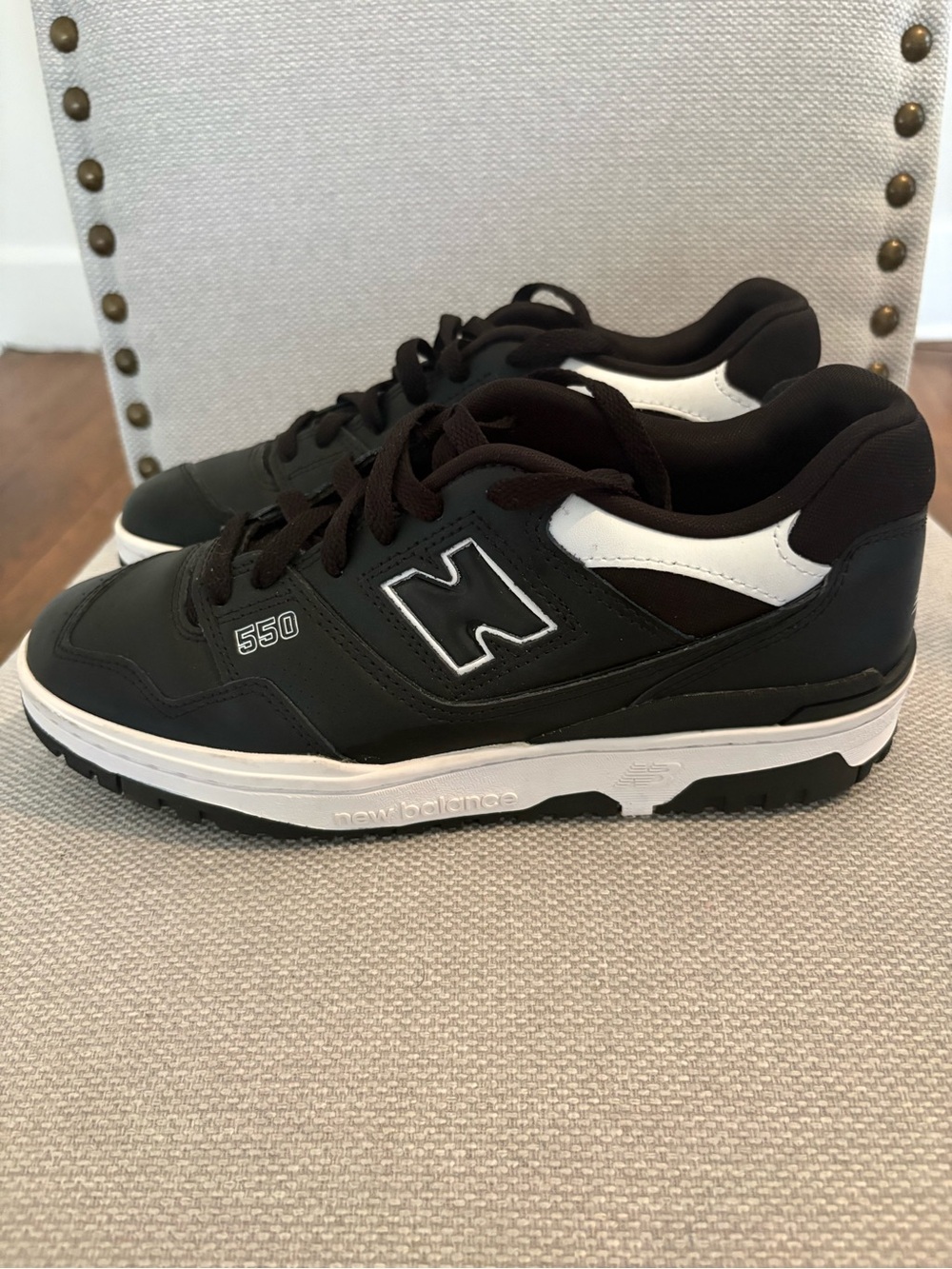 Pre owned New Balance 550 women’s Black and White Low-Top Sneakers.